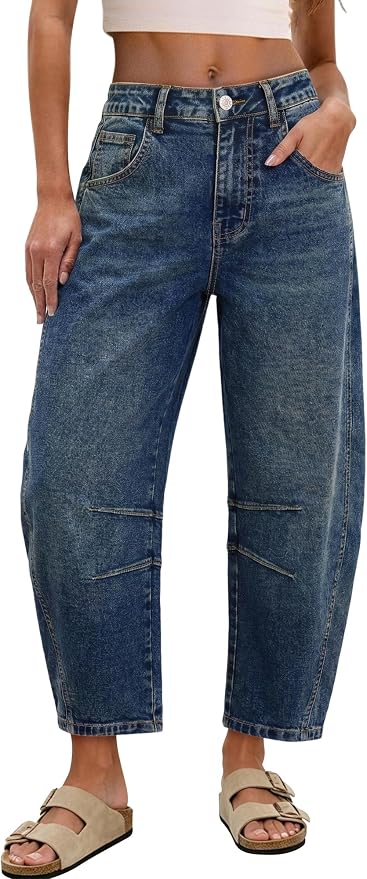 Medium-wash blue barrel-leg cropped jeans shown on a model from waist to feet. Features a high waist, wide tapered legs, front pockets, button closure, and horizontal seam detail at the knee. Paired with beige sandals.